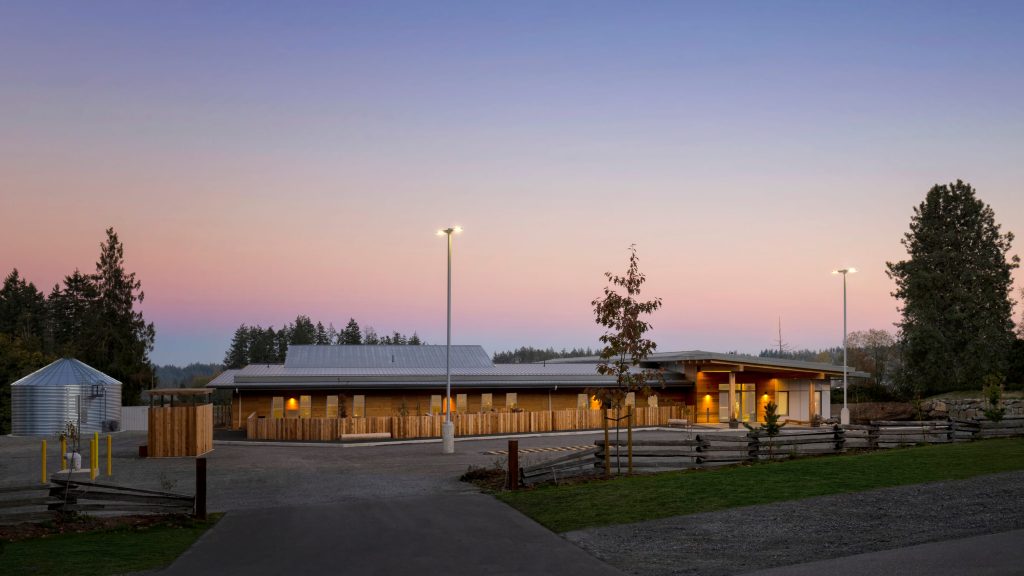 Modern wood timber building at dusk, professional exterior architectural photography in Cowichan Valley, Victoria, Vancouver.