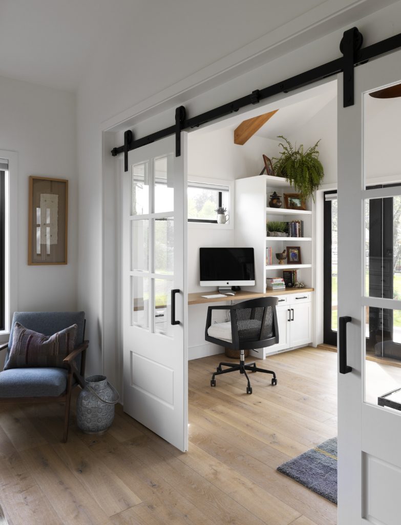 Modern office area with sliding doors in country farmhouse, interior design photography in Victoria and Vancouver.