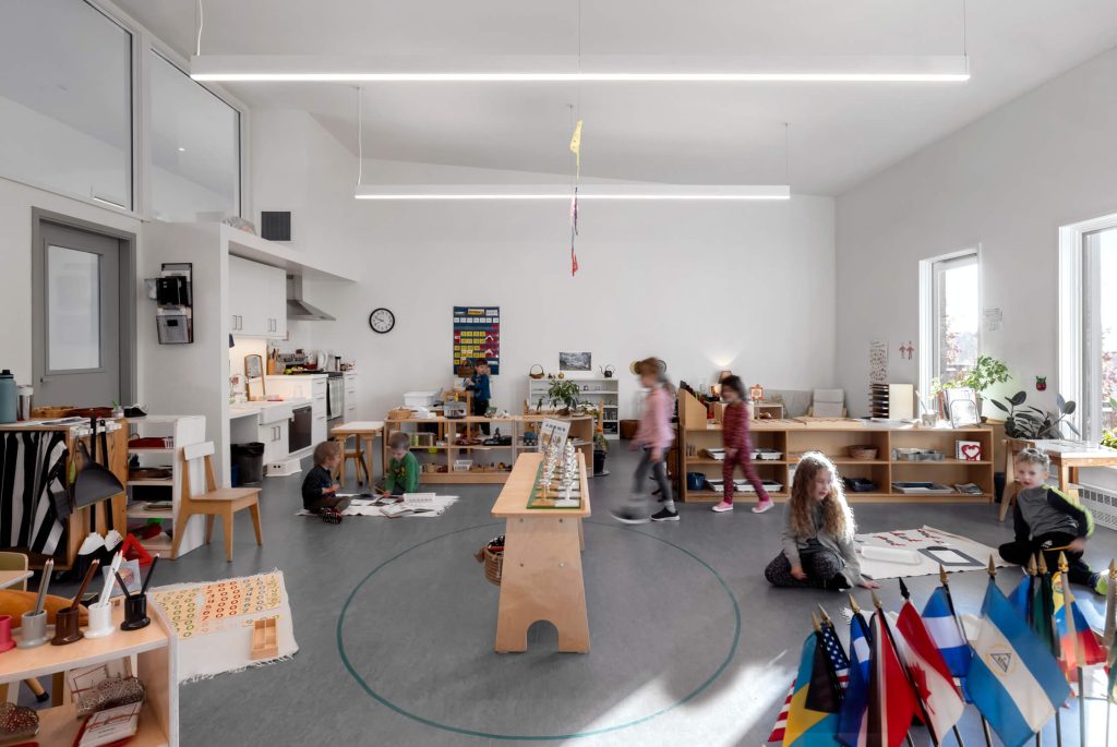 Children enjoying a bright modern learning environment, interior design photography by Tony Colangelo.