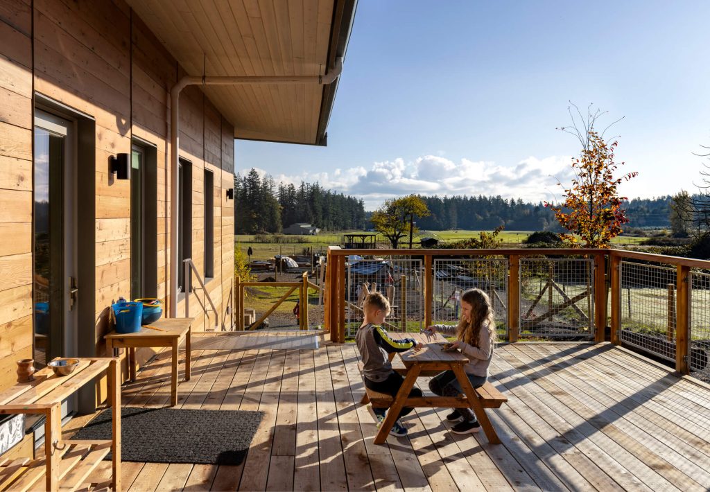 Outdoor play area with scenic rural views, exterior design architectural photography on Vancouver Island.