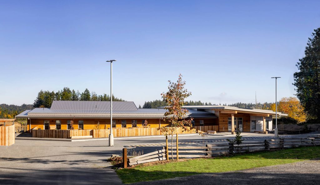 Switchback fence and parking area in front of modern wood timber facility, exterior design photography in Cowichan Valley, Nanaimo and Victoria.