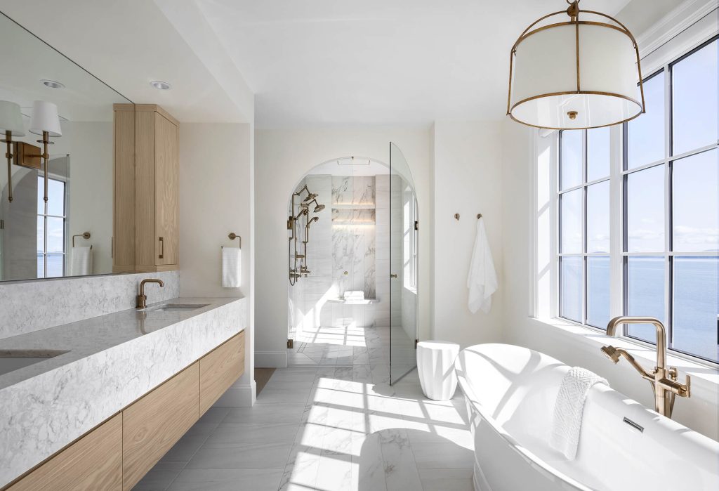 Modern bright bathroom with stunning ocean views, interior design photographer Tony Colangelo.