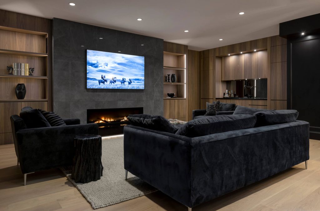 Fireplace home theatre with mood lighting, interior design photography by Tony Colangelo.