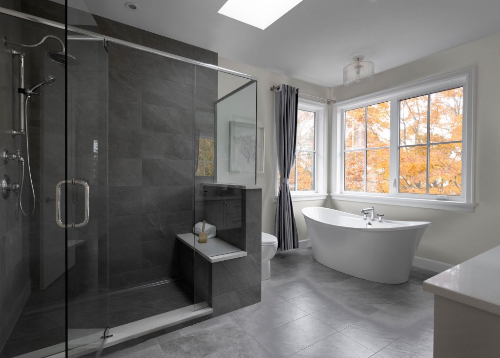 Striking contrasted bathroom with dark shower tile, interior design photography in Victoria.